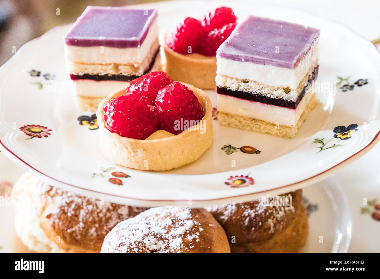 A stand full of delicious cakes for an English afternoon tea. Stock Photo