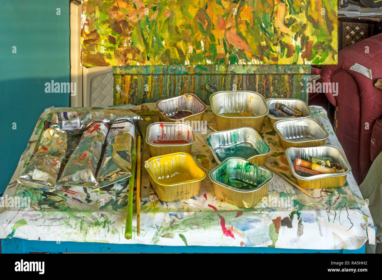 A table with mixed colours in trays used on a painting Stock Photo