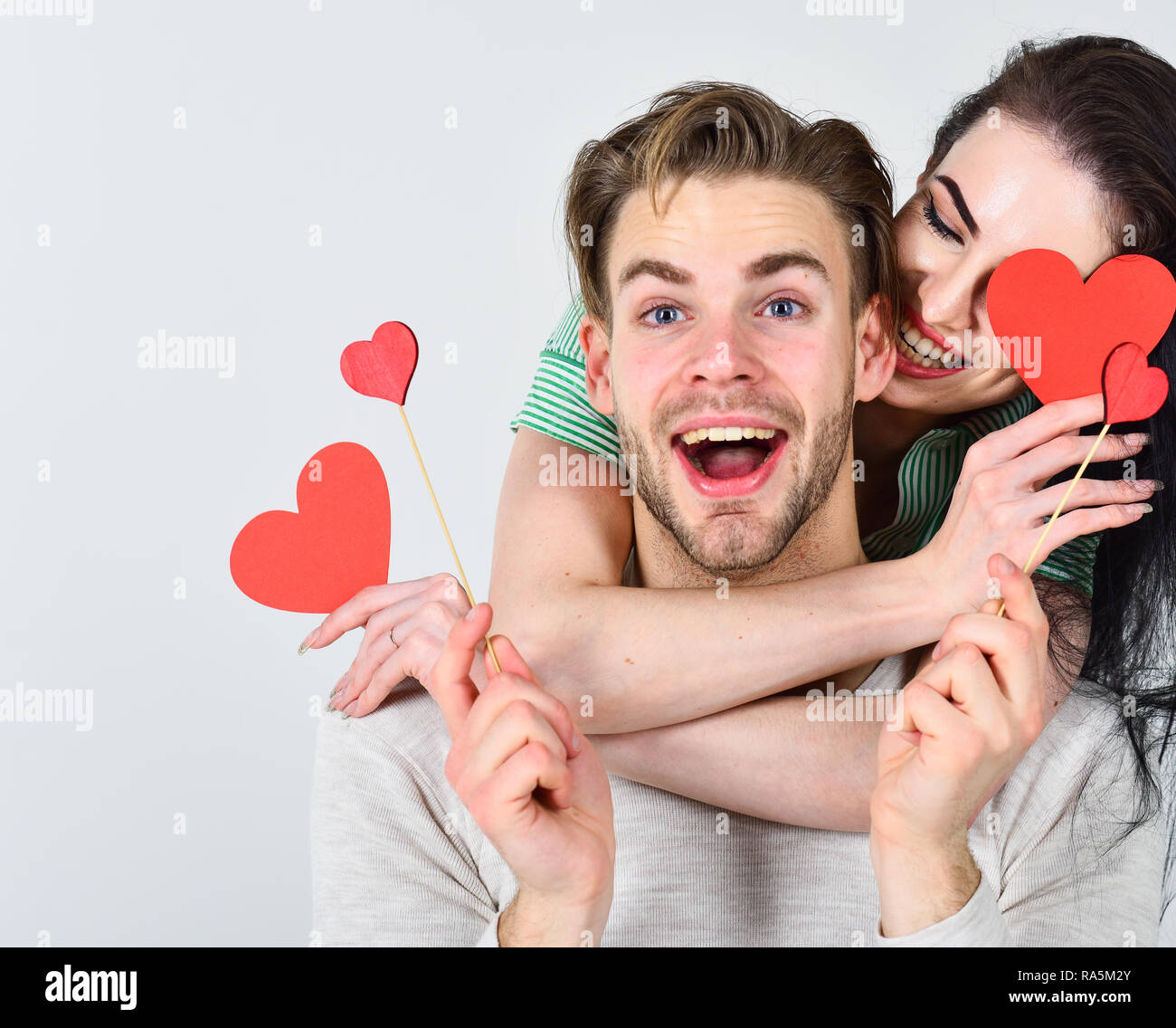 Valentines day and love. Man and woman couple in love hold red heart ...