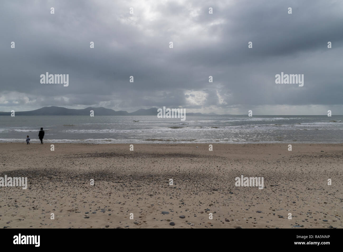 Grey Overcast Day at the Beach, Llanddwyn Bay, Anglesey, Wales, UK Stock Photo