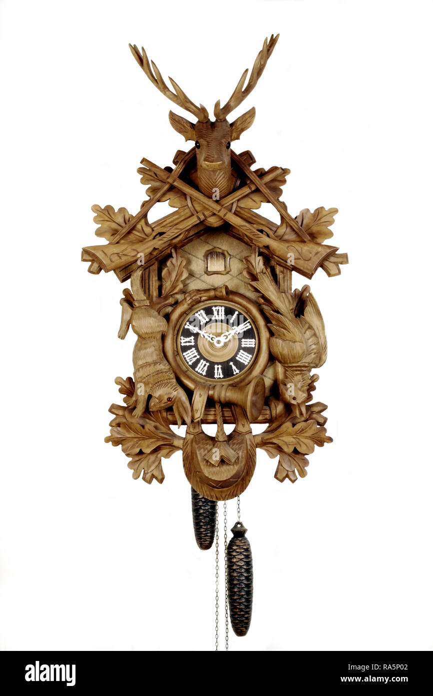 old black forest cuckoo clock in front of white background Stock Photo