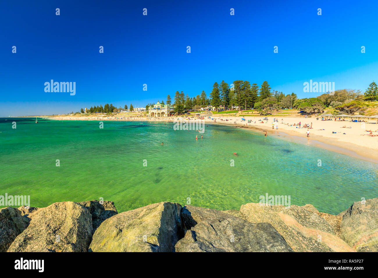 Cottesloe Beach in Western Australia: white sand and calm turquoise waters. The Perth's most famous beach, Indian Ocean. Summertime in blue sky. Copy space. Stock Photo