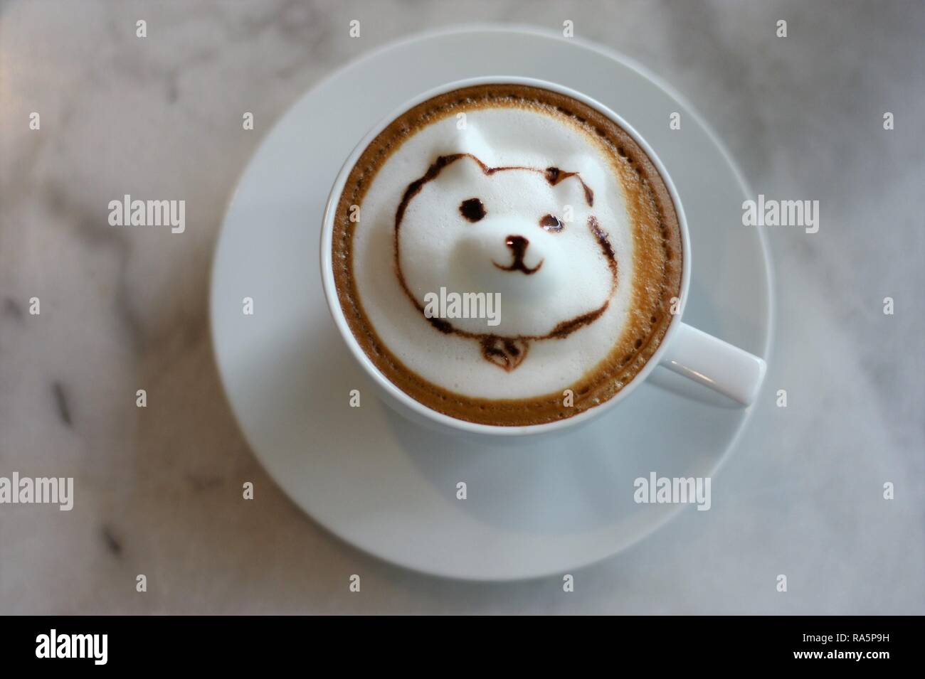 Cute Dog cappuccino latte 3d art coffee on marble table Stock Photo