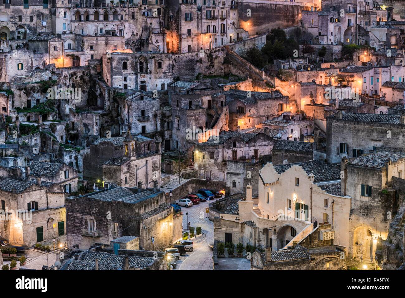 Old town district at dusk, Matera, Basilicata, Italy Stock Photo