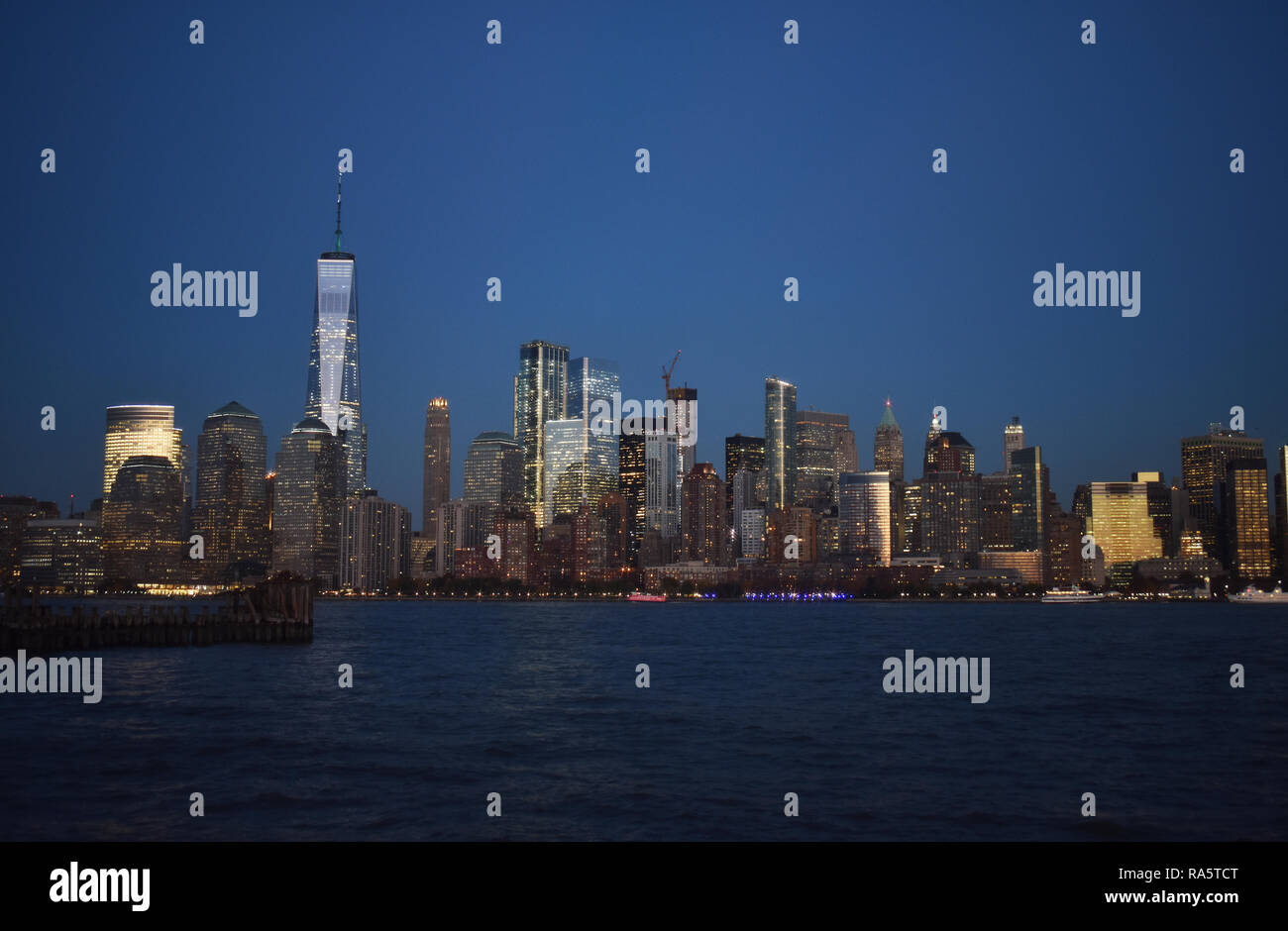 Night view of NYC Waterway and World Financial Center from Liberty State Park in Jersey City, New Jersey Stock Photo