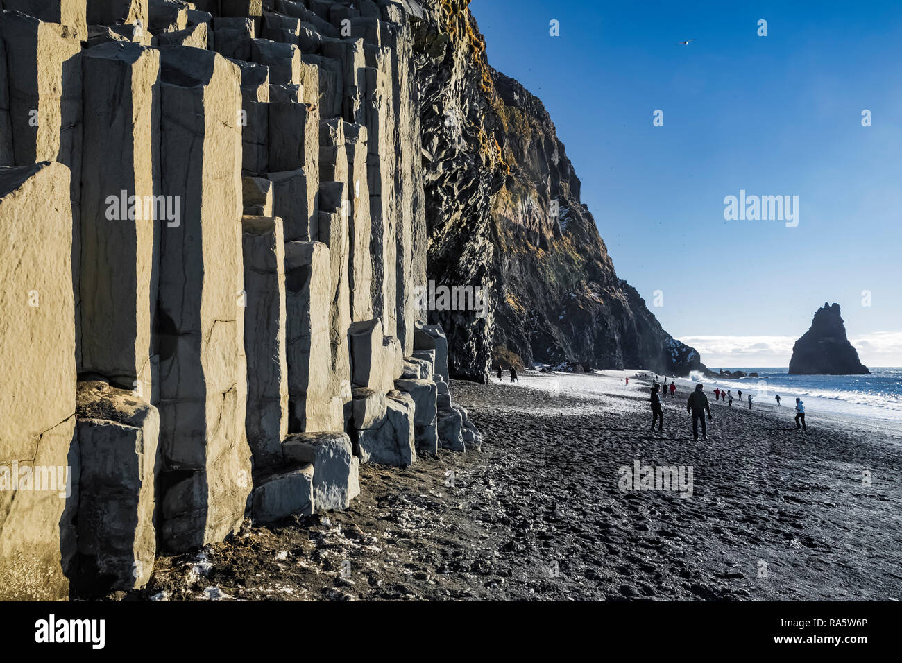 Columnar basalt formations along Reynisfjara Black Sand Beach in Iceland {No model releases; available for editorial licensing only] Stock Photo