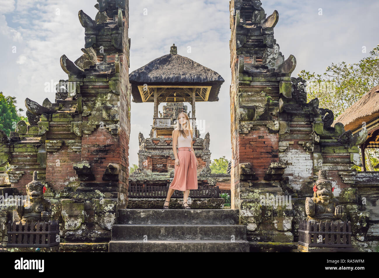 Young woman tourist in Traditional balinese hindu Temple Taman Ayun in Mengwi. Bali, Indonesia Stock Photo