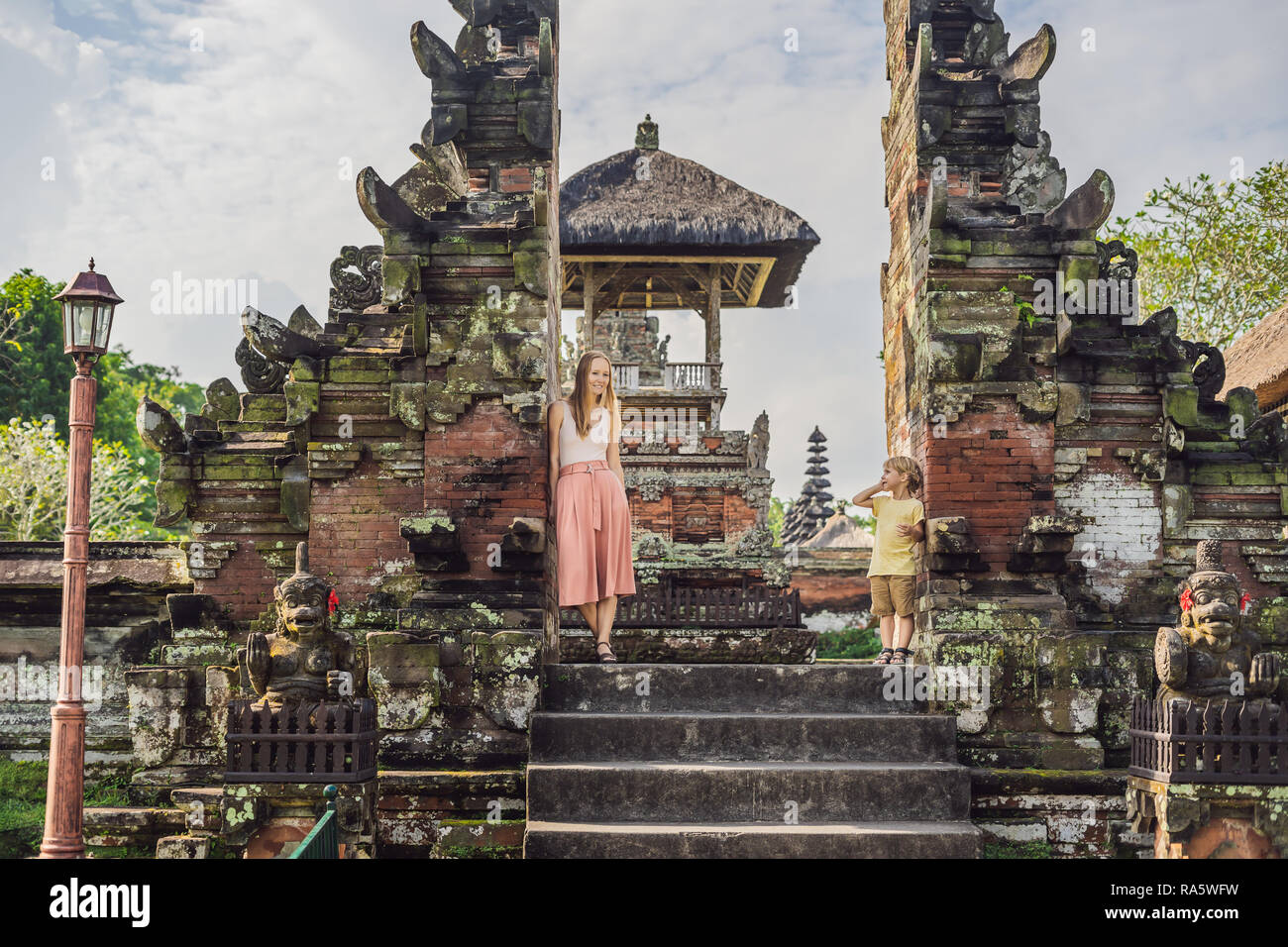 Mom and son tourists in Traditional balinese hindu Temple Taman Ayun in Mengwi. Bali, Indonesia Traveling with children concept Stock Photo