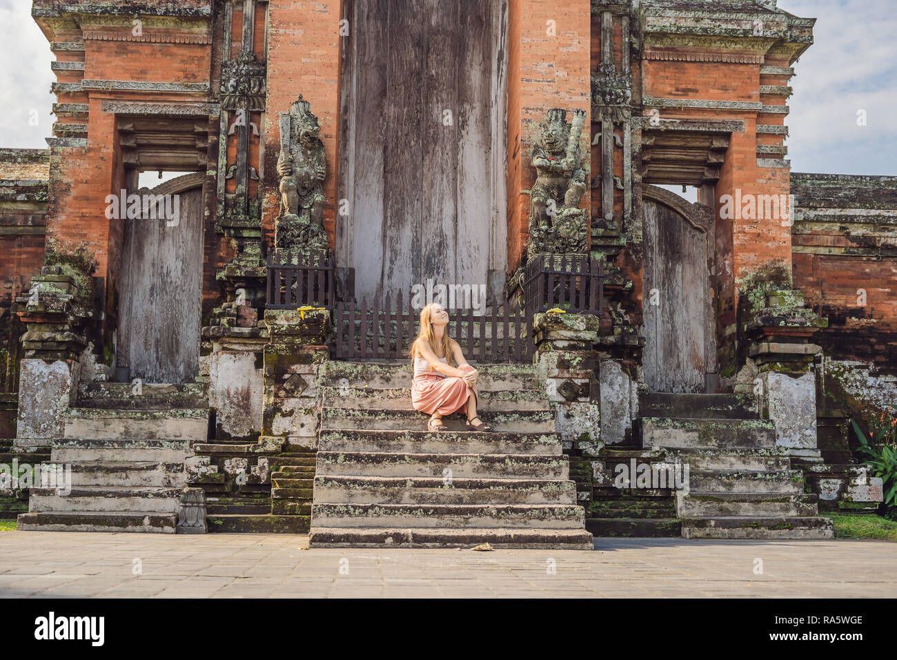 Young woman tourist in Traditional balinese hindu Temple Taman Ayun in Mengwi. Bali, Indonesia Stock Photo