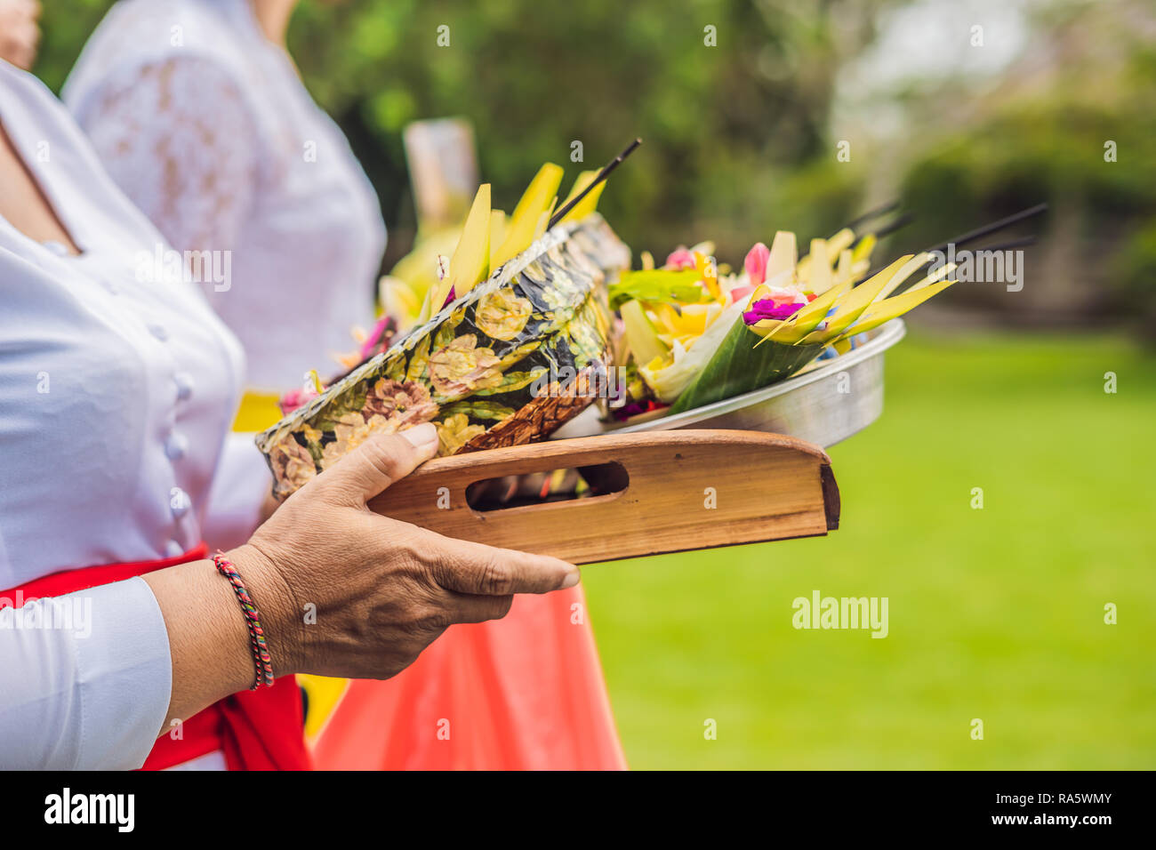 Balinese Hindu Offerings Called Canang. Canang sari is one of the daily offerings made by Balinese Hindus to thank the Sang Hyang Widhi Wasa in praise and prayer and can be seen everywhere in Bali Stock Photo