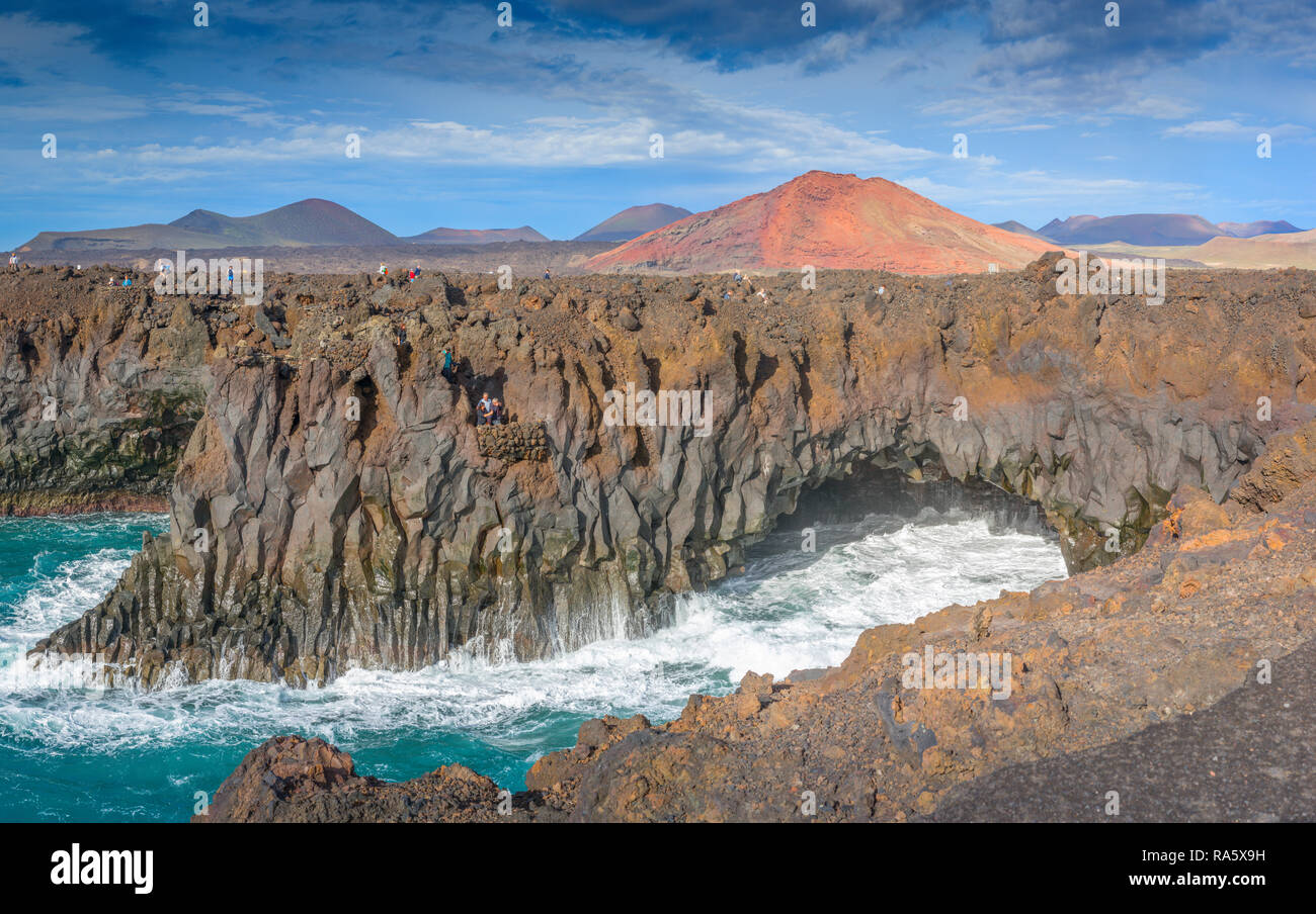 The rugged volcanic coastal rocks of Los Hervideros on the Islands of Lanzarote, pounded by the ferocious Atlantic Sea Stock Photo