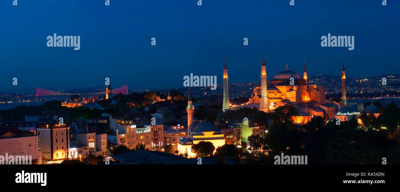 Panorama over Hagia Sophia museum and Bosphorus bridge at night, Istanbul, Turkey Stock Photo