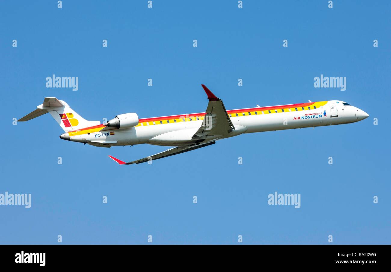 Air Nostrum, Iberia Regional, Canadair CL-600-2E25, Regional Jet CRJ-1000, after taking off from Duesseldorf Airport Stock Photo