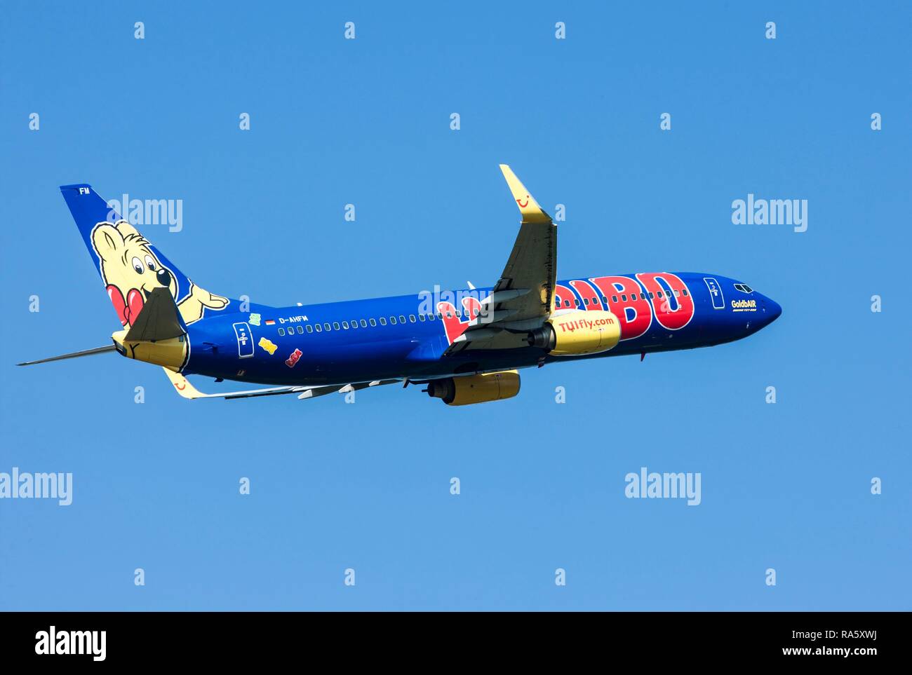 TUIfly, Boeing 737-800, painted with Haribo advertising, after taking off from Duesseldorf Airport, North Rhine-Westphalia Stock Photo