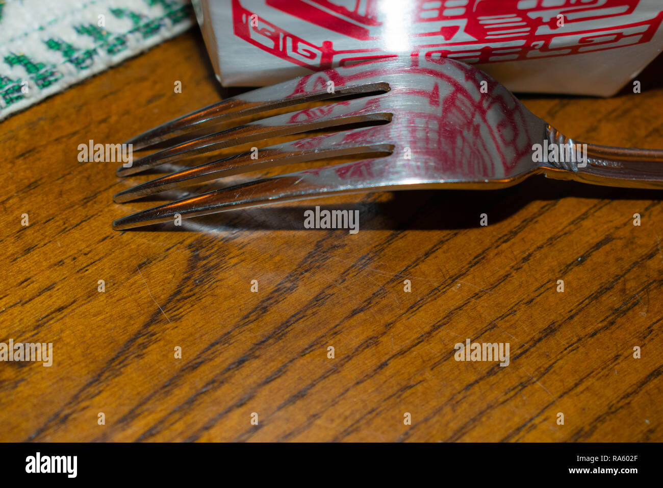 Chinese food reflection on fork Stock Photo Alamy