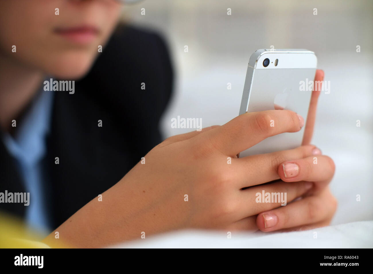 School age girl using smartphone Stock Photo