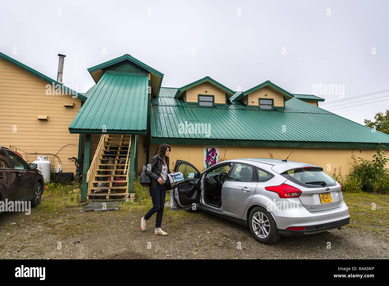Alaska, USA Sept 10th 2017 A tourist entering a rented car in front