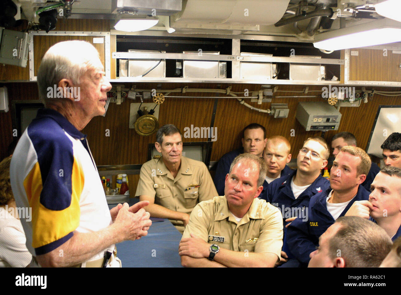 2005 - Former US President James E. Carter addresses the crew onboard his namesake ship, the Sea Wolf Class Attack Submarine USS JIMMY CARTER (SSN 23) in the crew's mess. President Carter and his wife, Rosalynn, spent the night aboard the submarine, touring the ship and meeting with crew members. The USS JIMMY CARTER is the third in Sea Wolf Class Attack Submarine. Stock Photo