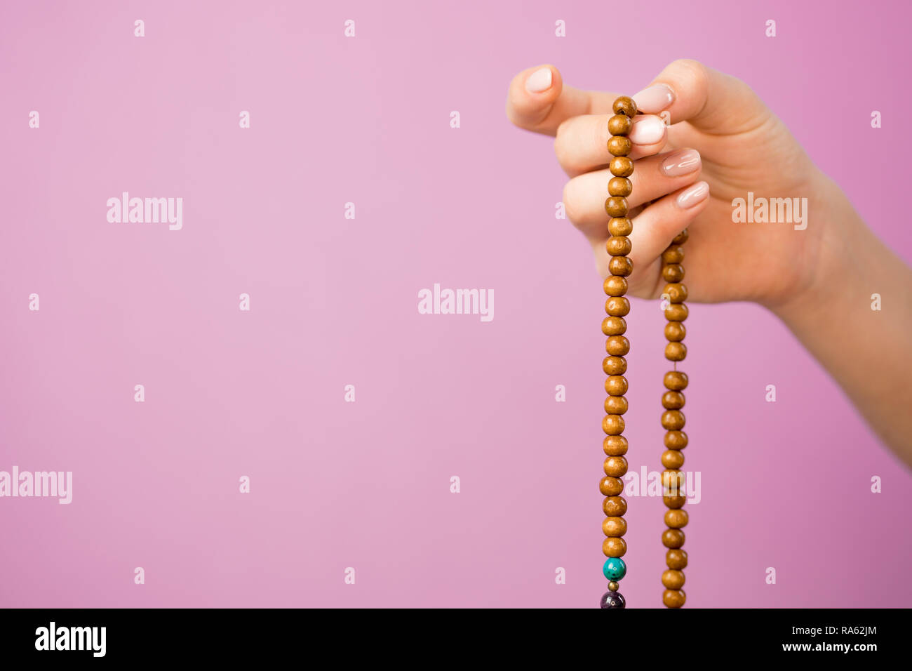 Hand and japa mala prayer beads hi-res stock photography and