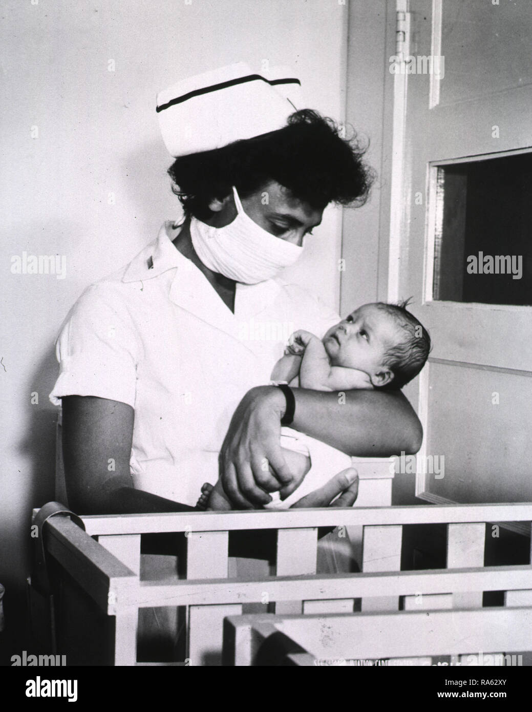 1940s nurse holding baby hi-res stock photography and images - Alamy