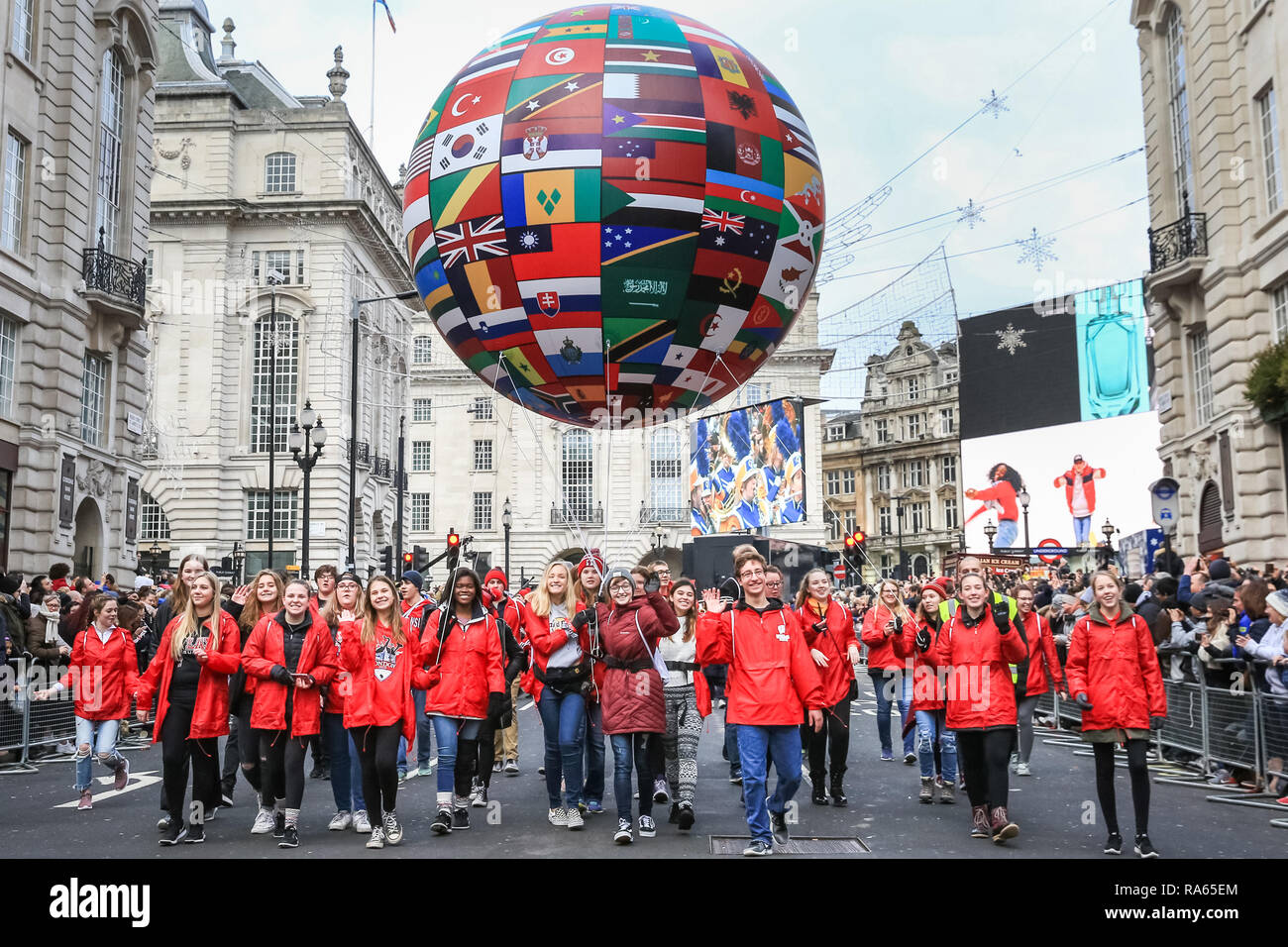 London, UK. 1st Jan 2019. A giant balloon with international flags makes  its way through London. London's New Year's Day Parade 2019, or LNYDP,  features just over 10,000 participants from the USA,