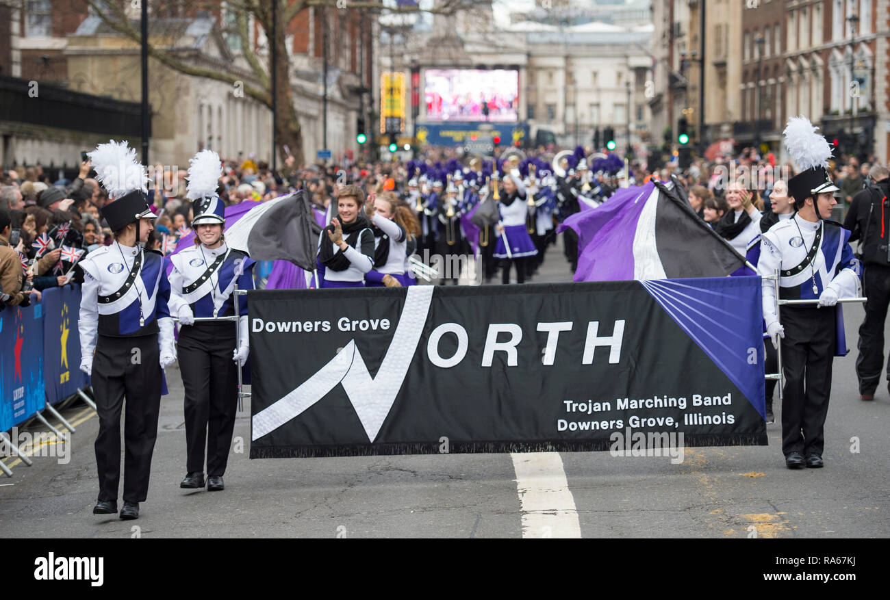 Westminster, London, UK. 1 January 2019. The annual London New Years Day Parade takes place on a route from Piccadilly to Parliament Square, watched by thousands. This years theme is London Welcomes The World. Image: Downers Grove North High School Trojan Marching Band, Illinois, USA. Credit: Malcolm Park/Alamy Live News. Stock Photo