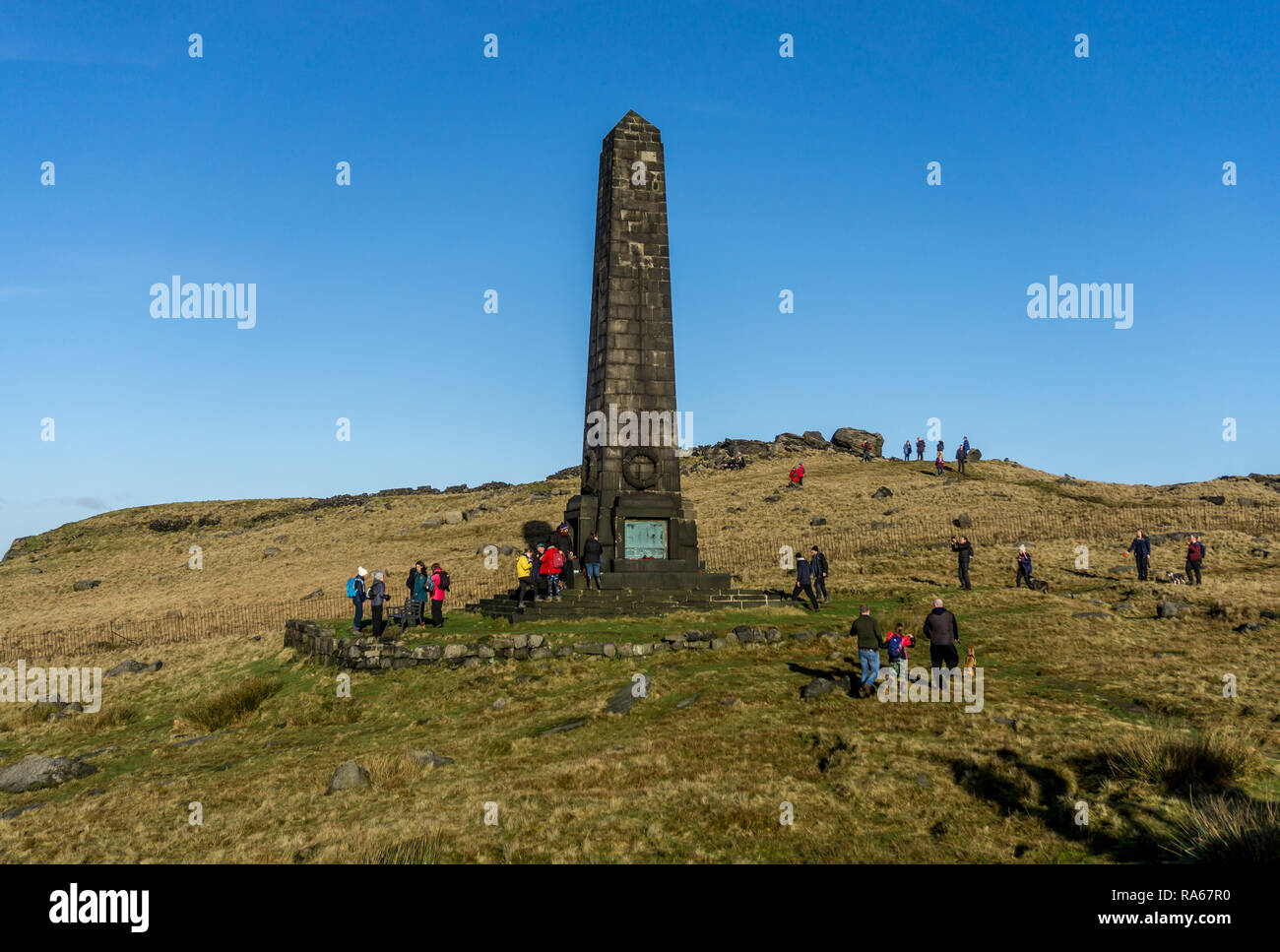 Obelisk War memorial,Aldermans Hill,  Lancashire, UK. 1st January, 2019. A warm sunny New Years Day prompts many walkers and ramblers to climb to the top of Aldermans Hill, Saddleworth moor, to visit the Obelisk War memorial. 1st January 2019. Carl Dickinson/Alamy Live news Stock Photo