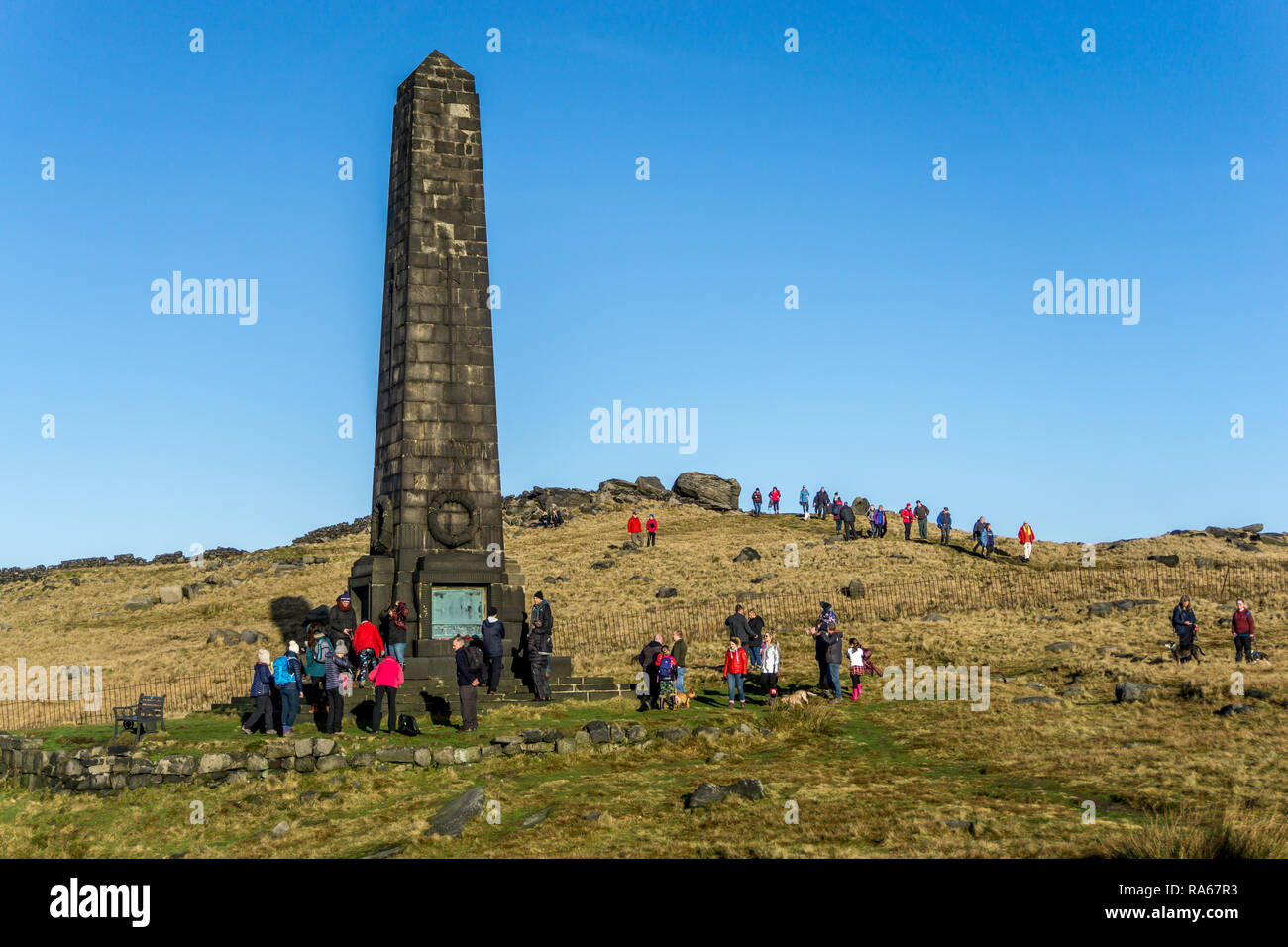 Obelisk War memorial,Aldermans Hill,  Lancashire, UK. 1st January, 2019. A warm sunny New Years Day prompts many walkers and ramblers to climb to the top of Aldermans Hill, Saddleworth moor, to visit the Obelisk War memorial. 1st January 2019. Carl Dickinson/Alamy Live news Stock Photo