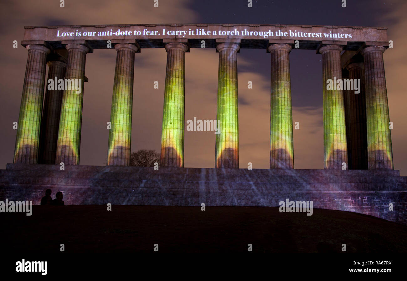 Edinburgh, Scotland, UK. 01 January 2019. National Monument, Calton Hill, Edinburgh. Message from the Skies returns to Edinburgh’s Hogmanay on  Tuesday 1 January with a selection of love letters written to Europe. The words of six internationally celebrated writers - Billy Letford, Chitra Ramaswamy, Kapka Kassabova, Louise Welsh, Stef Smith and William Dalrymple - will illuminate and animate buildings around the city during the first month of 2019. Message from the Skies runs until Friday 25 January 2019 Stock Photo