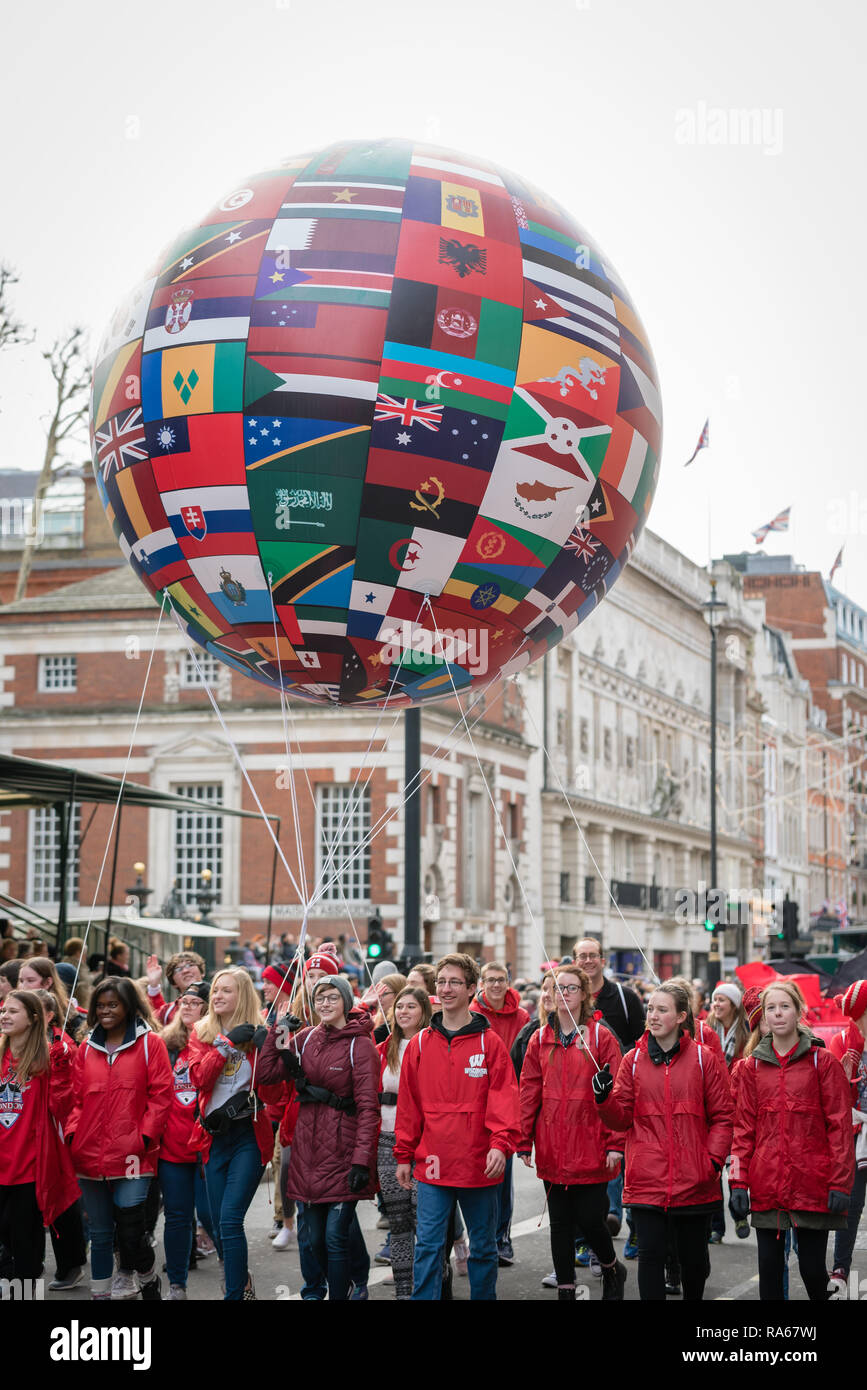 London, UK.  1 January 2019.   The theme of the parade this year was “London Welcomes the World”. With thousands of performers from a multitude of different countries and cultures from all around the world parade through central  London. Acts included the Giant Global Balloon.  Credit: Ilyas Ayub / Alamy Live News Stock Photo