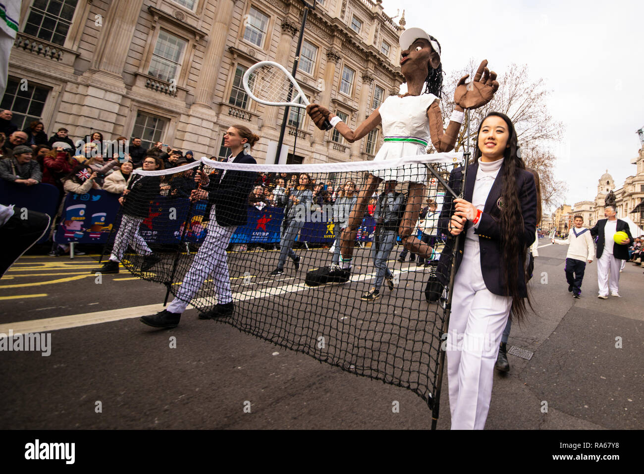 Tennis player effigies at London's New Year's Day Parade, UK. London Borough of Merton welcomes the world, Wimbledon theme figures Stock Photo