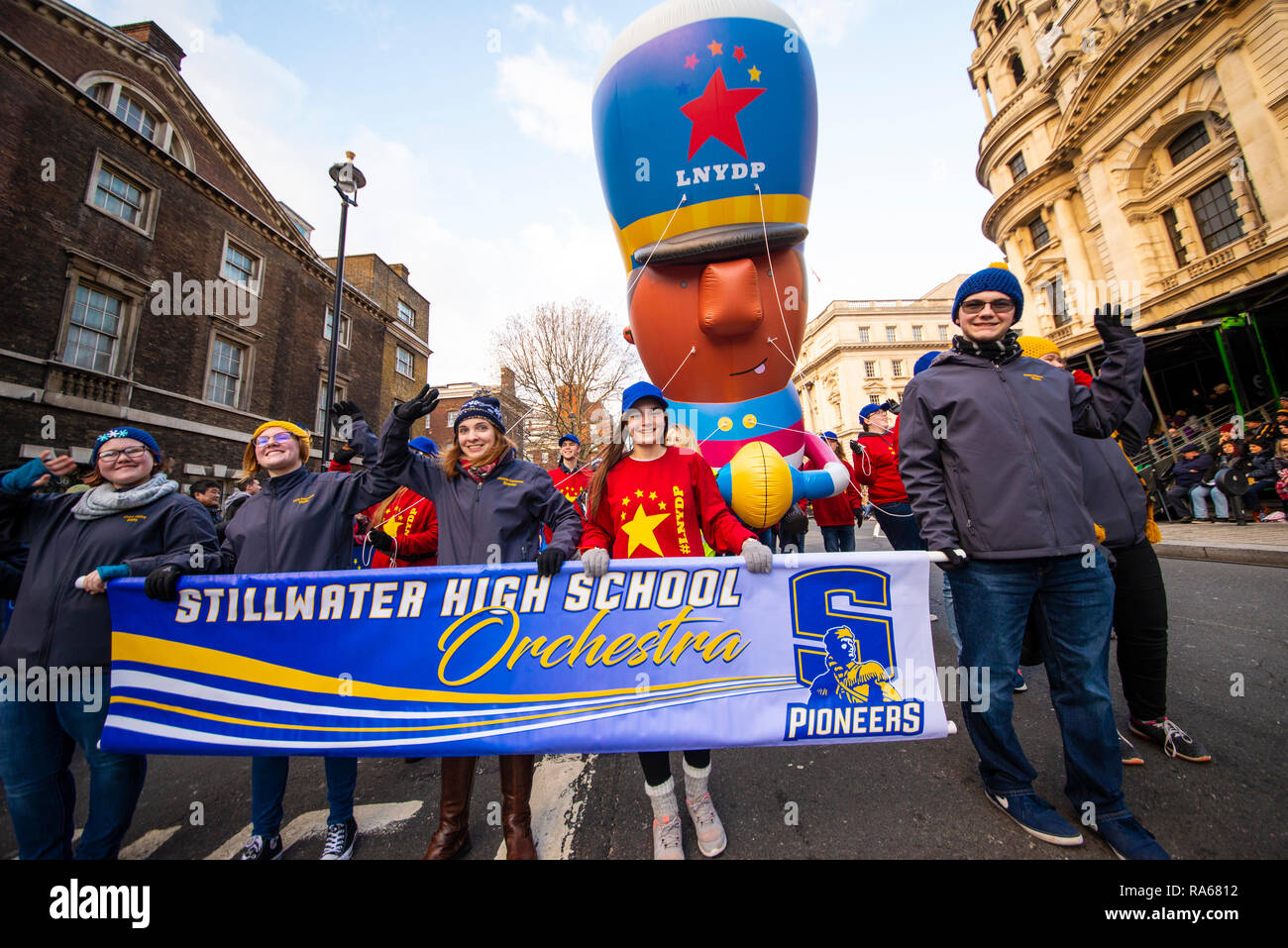 Stillwater High School Philharmonic String Orchestra from Oklahoma USA with Marching Band Player Giant Balloon at London's New Year's Day Parade 2019 Stock Photo