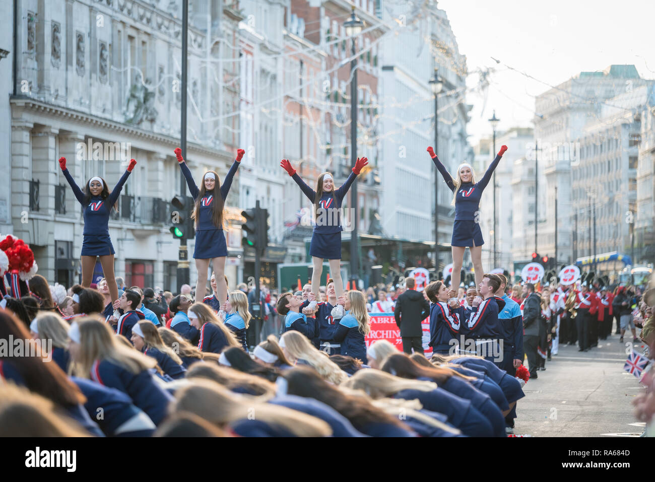 London, UK.  1 January 2019.   The theme of the parade this year was “London Welcomes the World”. With thousands of performers from a multitude of different countries and cultures from all around the world parade through central  London. Acts included the Varsity Spirit All-American Universal & National Cheerleaders Association.  Credit: Ilyas Ayub / Alamy Live News Stock Photo