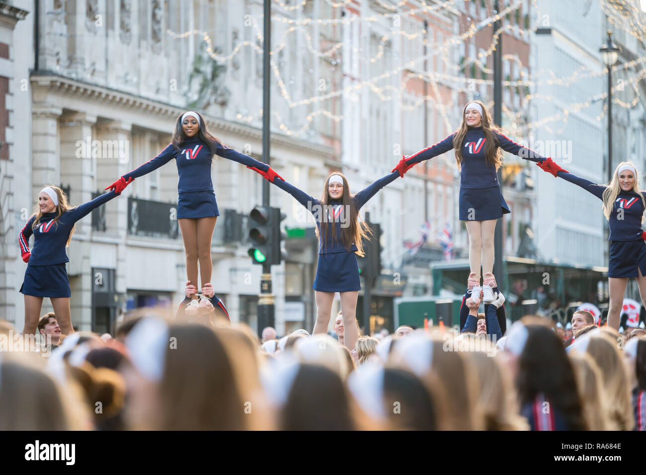 London, UK.  1 January 2019.  The theme of the parade this year was “London Welcomes the World”. With thousands of performers from a multitude of different countries and cultures from all around the world parade through central  London. Acts included the Varsity Spirit All-American Universal & National Cheerleaders Association.  Credit: Ilyas Ayub / Alamy Live News Stock Photo