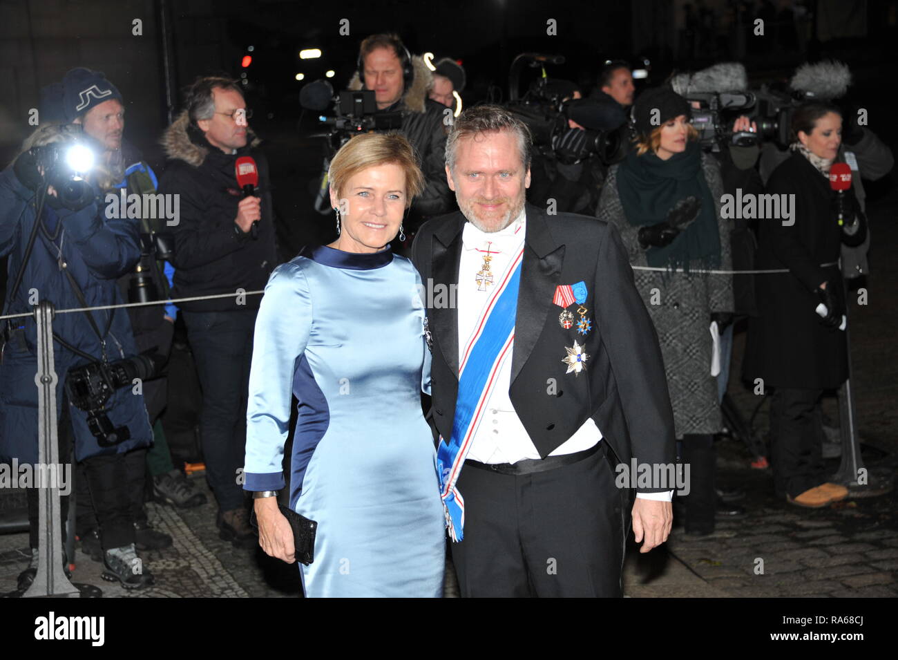 Copenhagen, Denmark. 1st January 2019. The Danish Minister for Culture Mette Bock (left) and his younger brother The Minister for Foreign Affairs of Denmark Anders Samuelsen (right) arrives to attend HM Queen Margrethe II’s annual New Year’s levee and banquet reception at Christian VII's Palace, Amalienborg Palace, Copenhagen on 1st January 2019. Credit: HFG/Alamy Live News Stock Photo