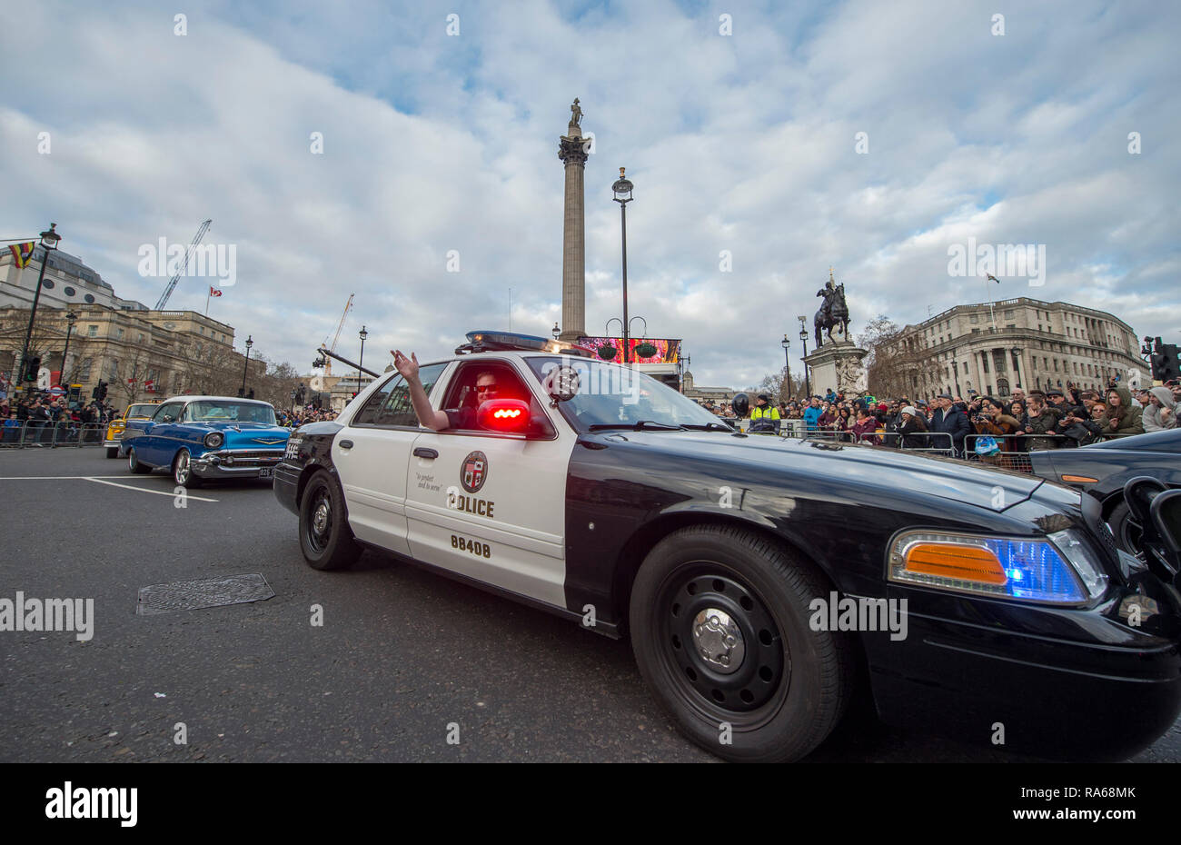 Westminster, London, UK. 1 January 2019. The annual London New Years Day Parade takes place on a route from Piccadilly to Parliament Square, watched by thousands. This years theme is London Welcomes The World. Image: American Cop and Classic Cars UK. Credit: Malcolm Park/Alamy Live News. Stock Photo