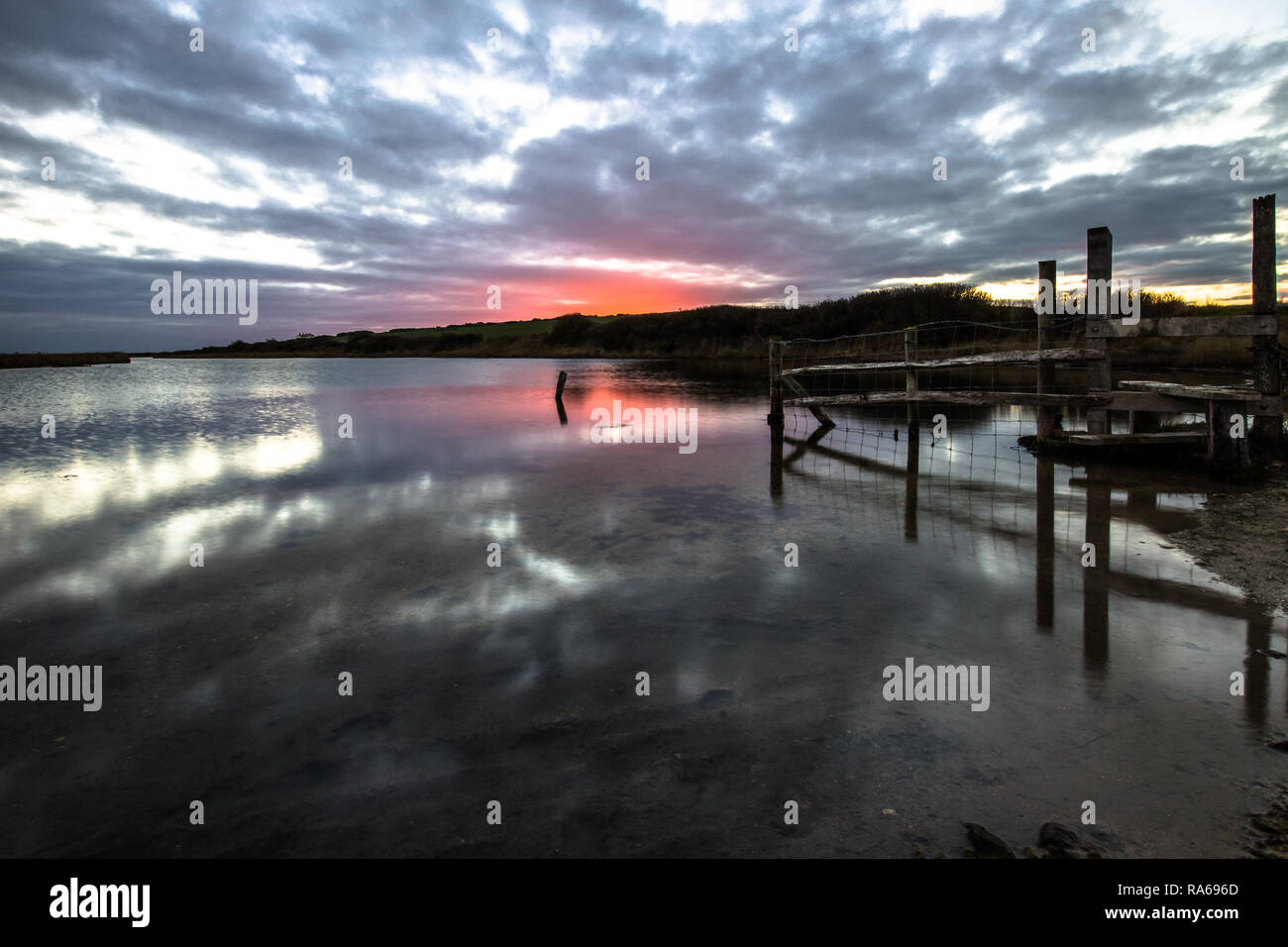 Seven Sisters Country Park, Seaford, East Sussex, UK. 1st Jan, 2019. A bracing walk at sunset towards the sea on the South Downs, to get some exercise and fresh air after Christmas excesses. Credit: Sarah Mott/Alamy Live News Stock Photo