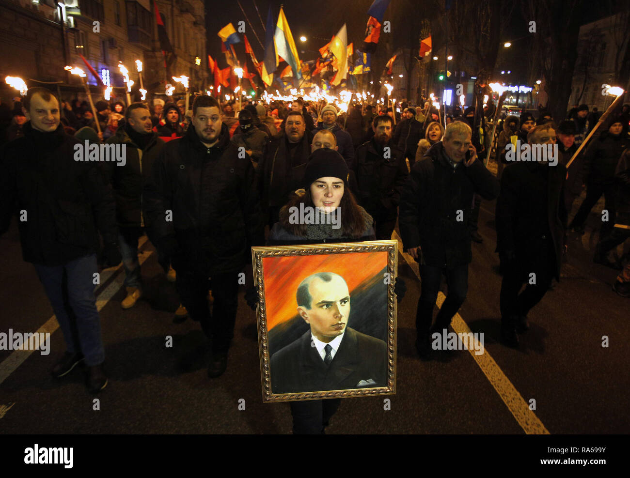 Kyiv, Ukraine. 1st Jan, 2019. A woman holds Stepan Bandera portrait ...