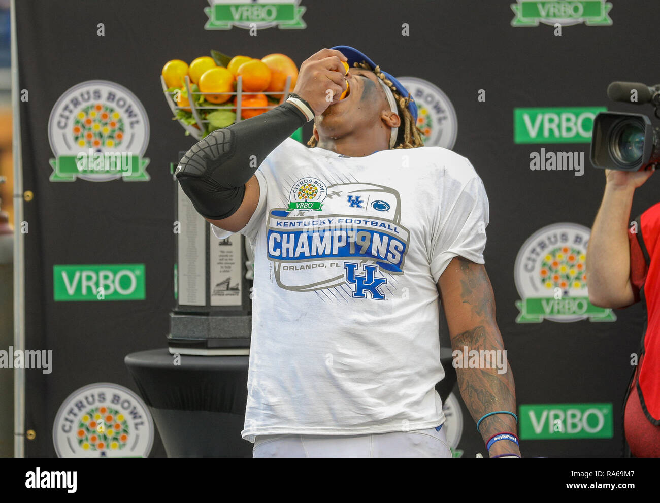 Orlando, Florida, USA. 1st Jan, 2019. Citrus Bowl MVP Benny Snell Jr #26 of Kentucky takes a bite out of an orange following the Citrus Bowl football game between the Kentucky Wildcats and the Penn State Nittany Lions at Camping World Stadium in Orlando, Florida. Kyle Okita/CSM/Alamy Live News Stock Photo