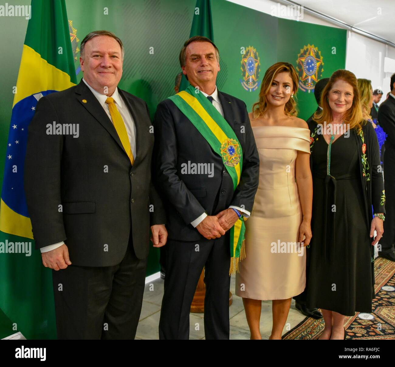 U.S. Secretary of State Mike Pompeo, left, and his wife Susan Pompeo, right, stands with Brazilian President Jair Bolsonaro and Brazilian First Lady Michelle de Paula Firmo Reinaldo Bolsonaro during the inaugural January 1, 2019 in Brasilia, Brazil. Stock Photo