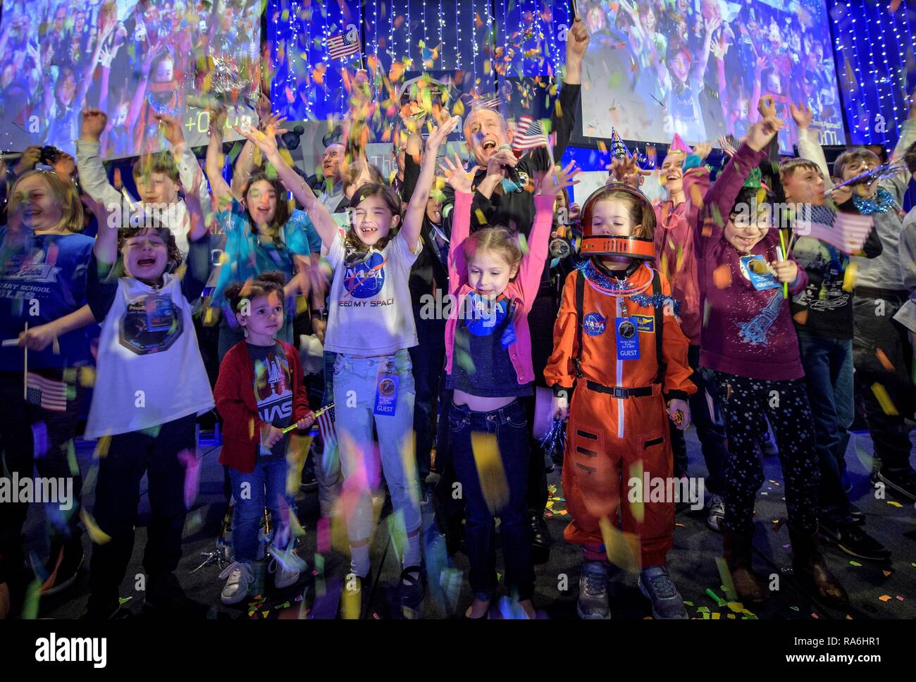 New Horizons principal investigator Alan Stern, center, of the Southwest Research Institute celebrates with school children at the moment the spacecraft was planned to reach its closest approach to Kuiper Belt object Ultima Thule at Johns Hopkins University Applied Physics Laboratory January 1, 2019 in Laurel, Maryland. Stock Photo