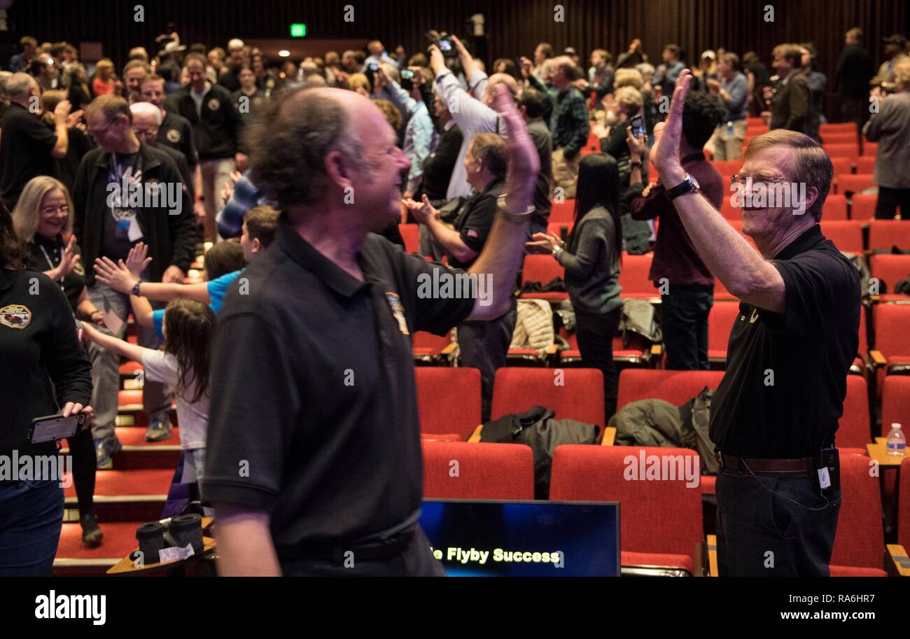 New Horizons project scientist Hal Weaver high-fives a New Horizons ...