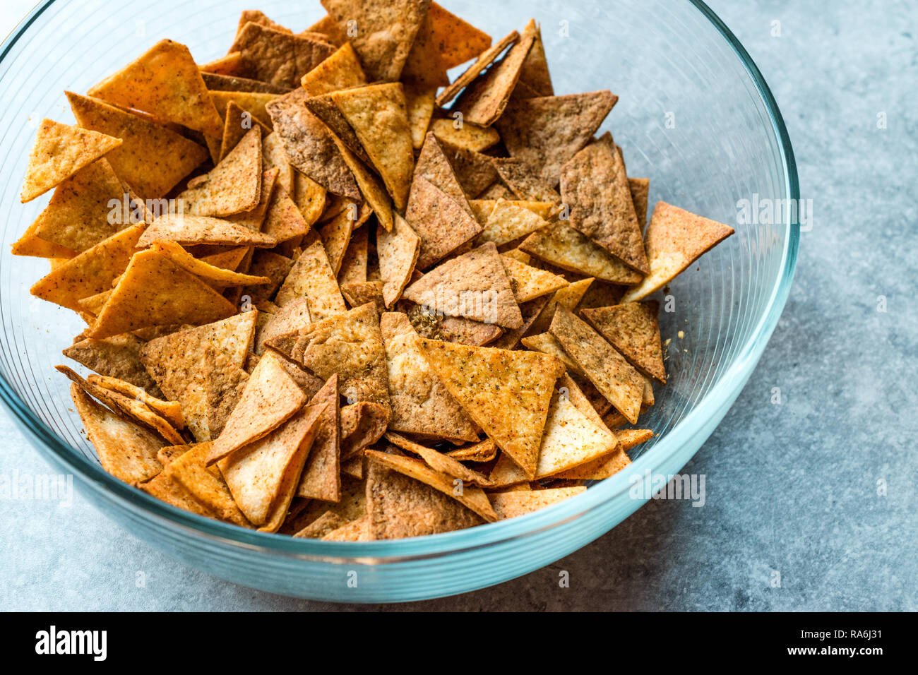 Homemade Tortilla Chips made with Flatbread in Glass Bowl and Baked in
