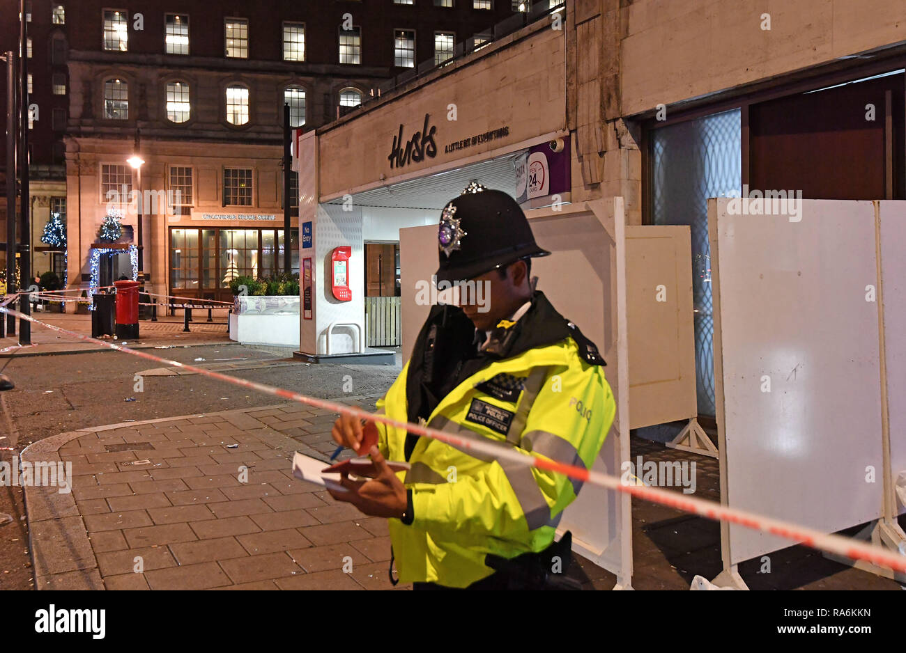 Police outside a property in Park Lane, London after a security guard was stabbed to death and three others injured as they tried to bar a group of men from entering a New Year's Eve party. Stock Photo