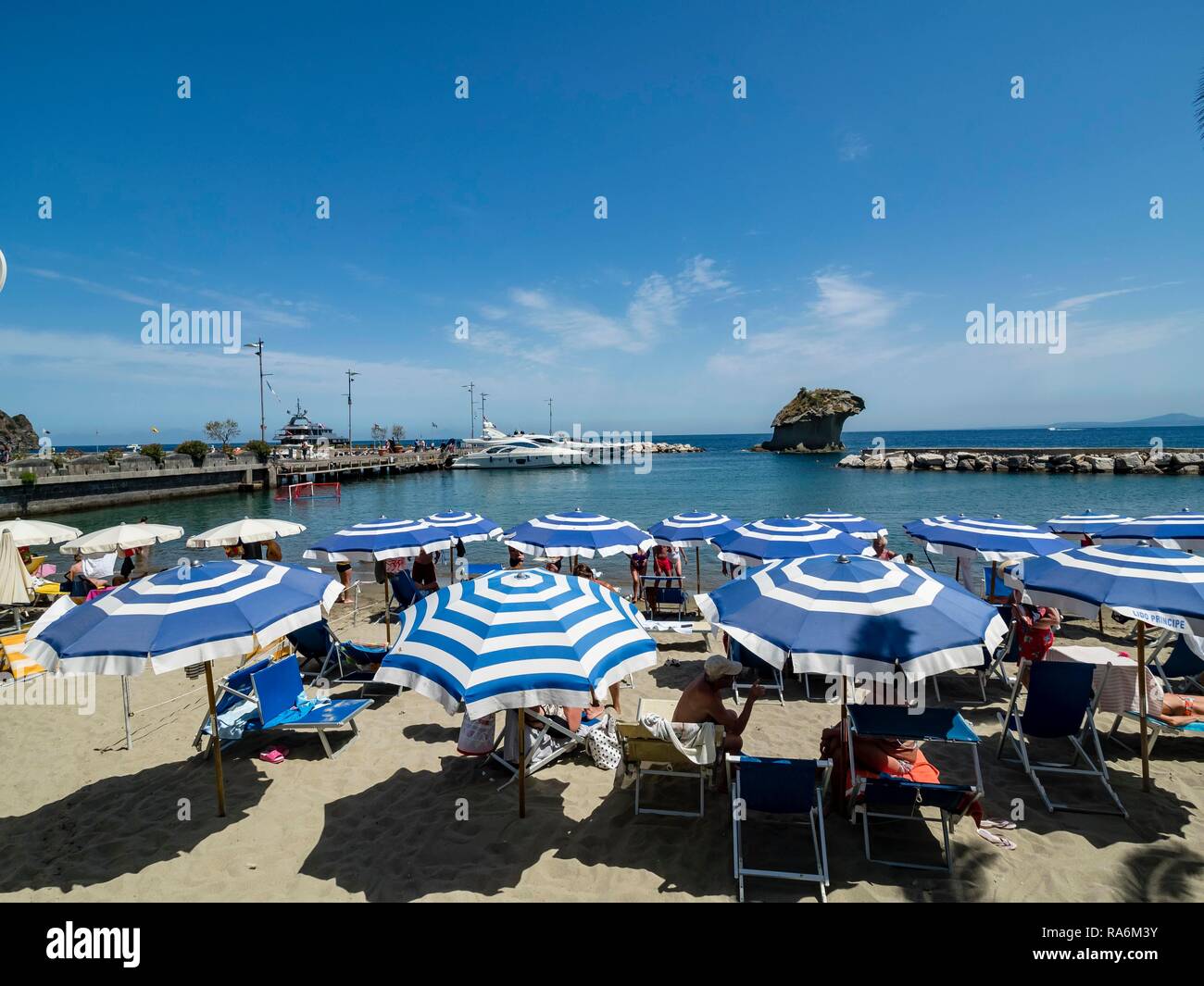 Sunshades, Corso Angelo Rizzoli, beach behind tuff rock il Fungo, Lacco ...