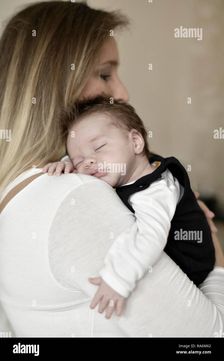 Mother holding baby, 4 weeks, Baden-Württemberg, Germany Stock Photo