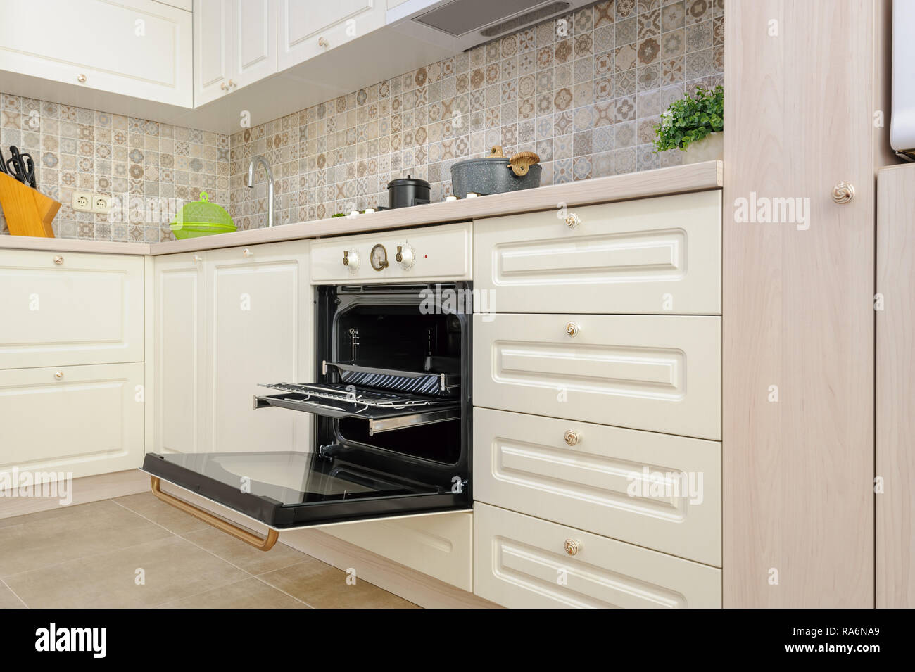 Modern hi-tek kitchen, oven with open door Stock Photo by ©starush