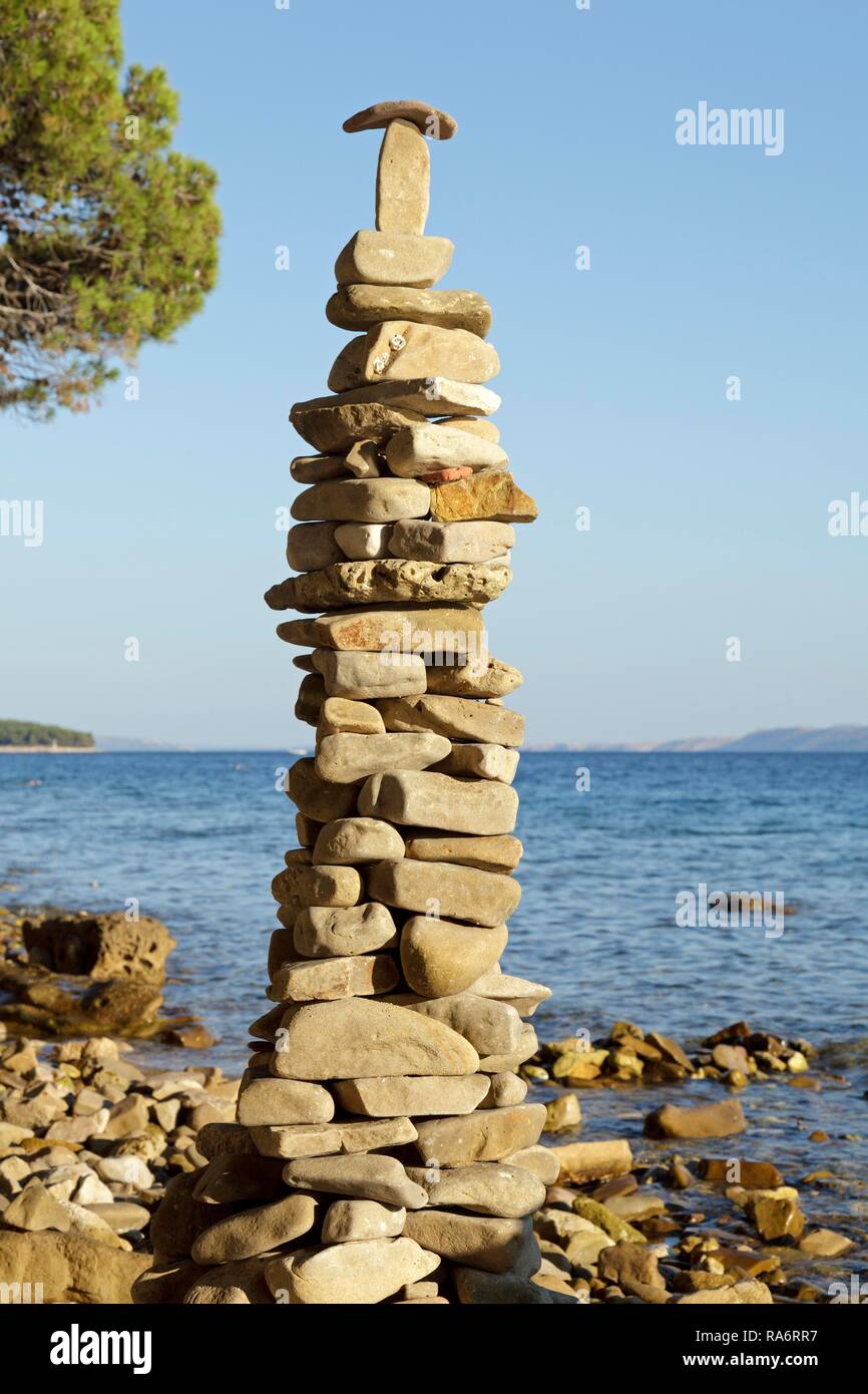 Tower of rocks or cairn on the beach, Rab, Rab, Primorje-Gorski Kotar, Croatia Stock Photo
