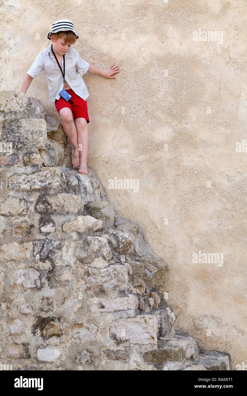Little boy on stone steps, Rab, Rab, Primorje-Gorski Kotar, Croatia Stock Photo