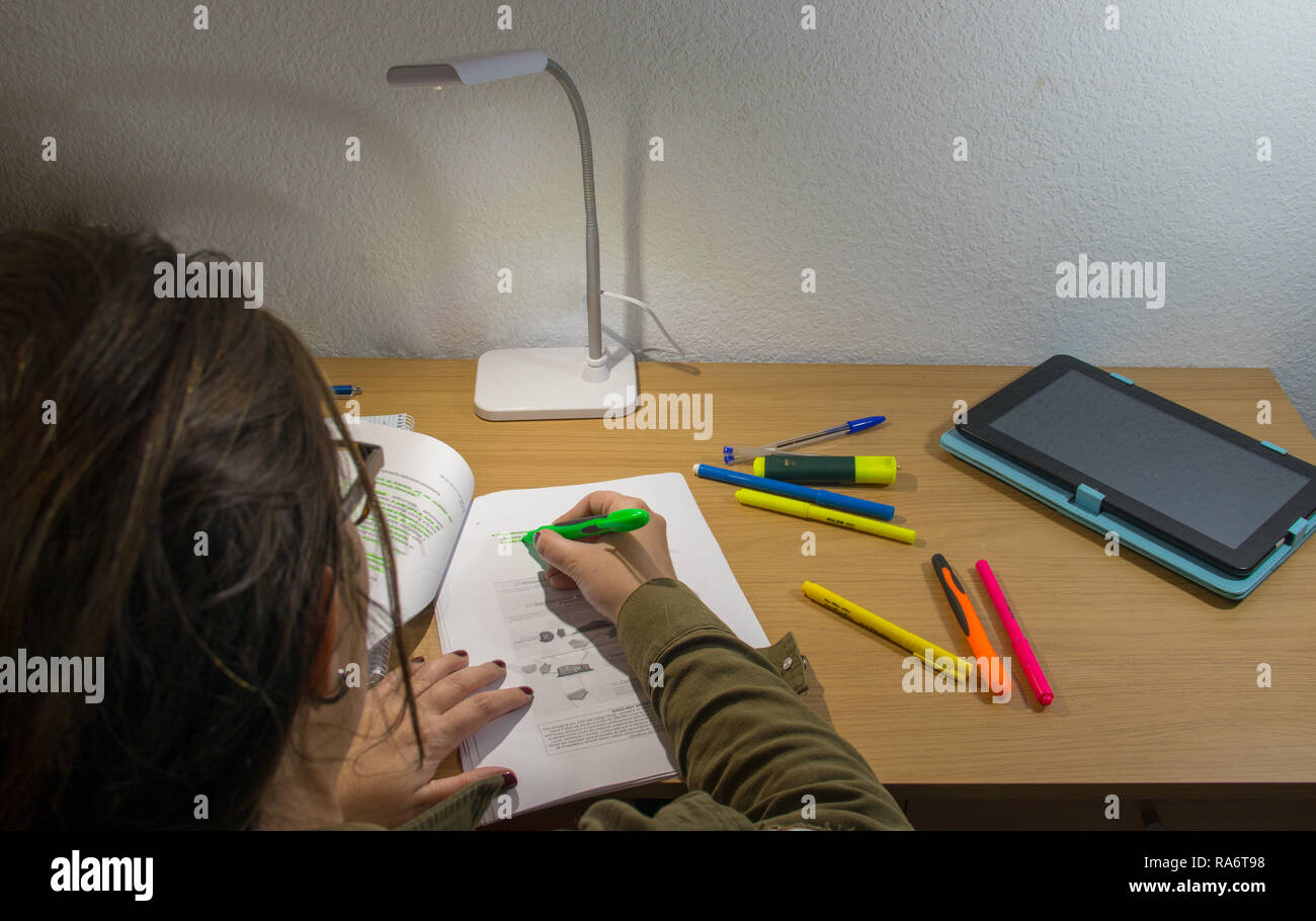 study table while underlining the notes Stock Photo - Alamy